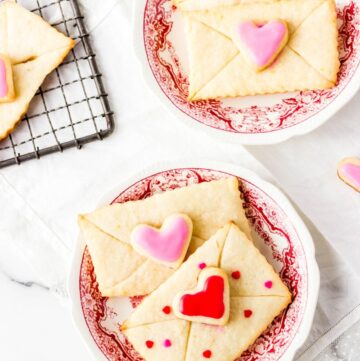 Love Letter cookies on a white and red plate
