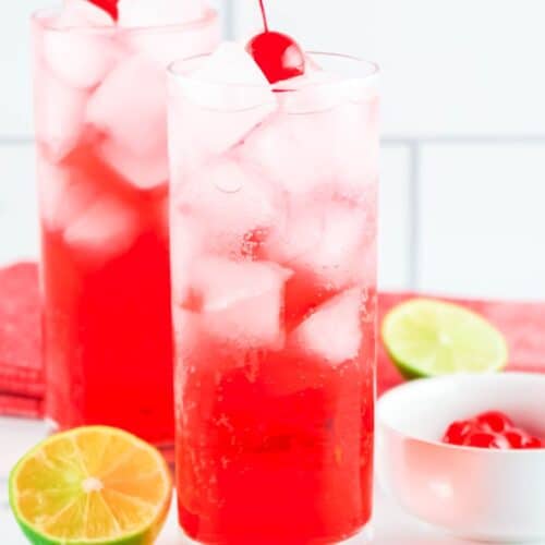 Lemon-lime soda, ice cubes, grenadine, and a maraschino cherry in a tall glass.