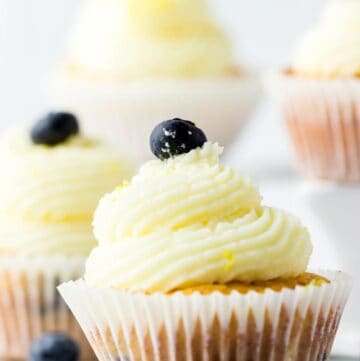 Lemon Blueberry Bisquick Cupcakes topped with frosting and blueberries