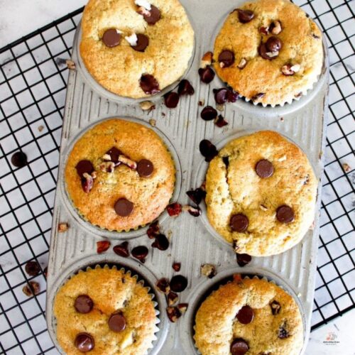 Muffins with bananas and chocolate chips in a metal muffin tin