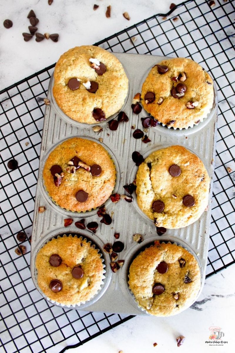 Muffins with bananas and chocolate chips in a metal muffin tin